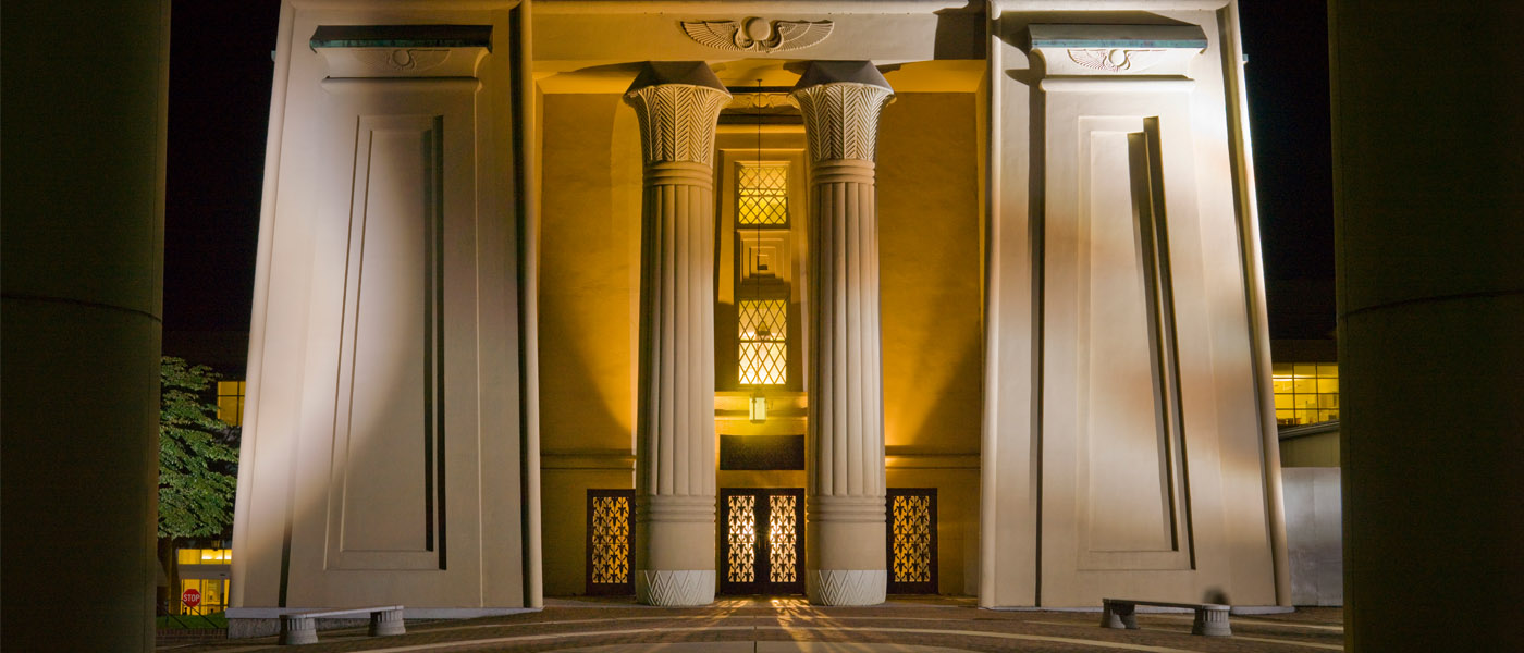 Front of the Egyptian Building illuminated at night
